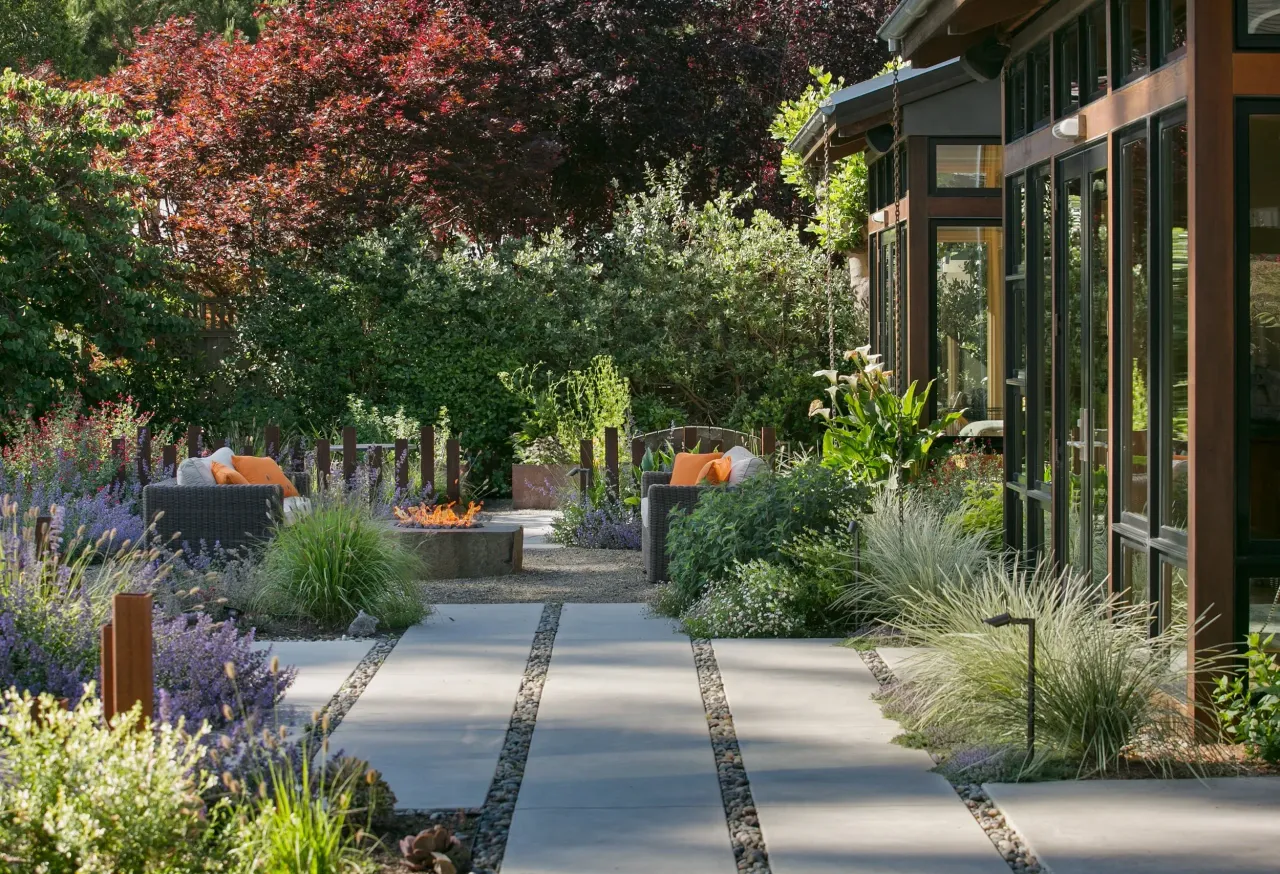 Modern home with a paver walkway and landscaped beds